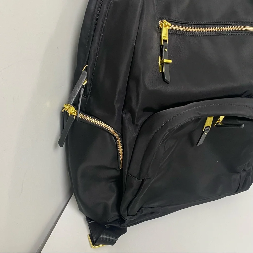Tumi Black Backpack with Gold Zippers